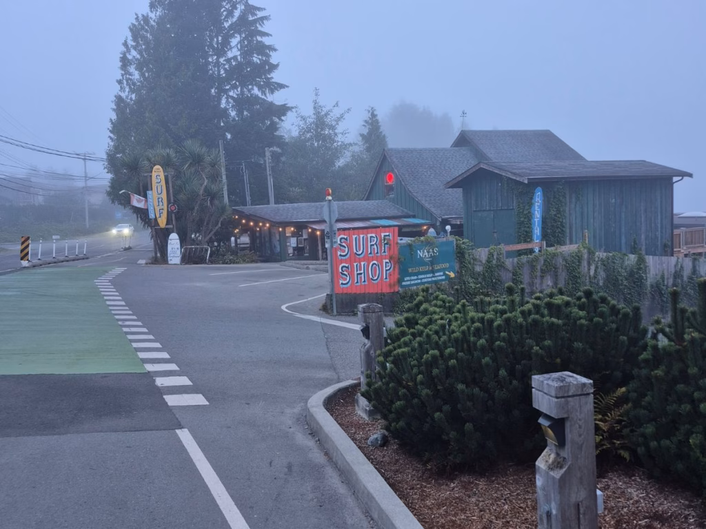 Tofino bike lane on a foggy morning passing a Surf Shop in BC