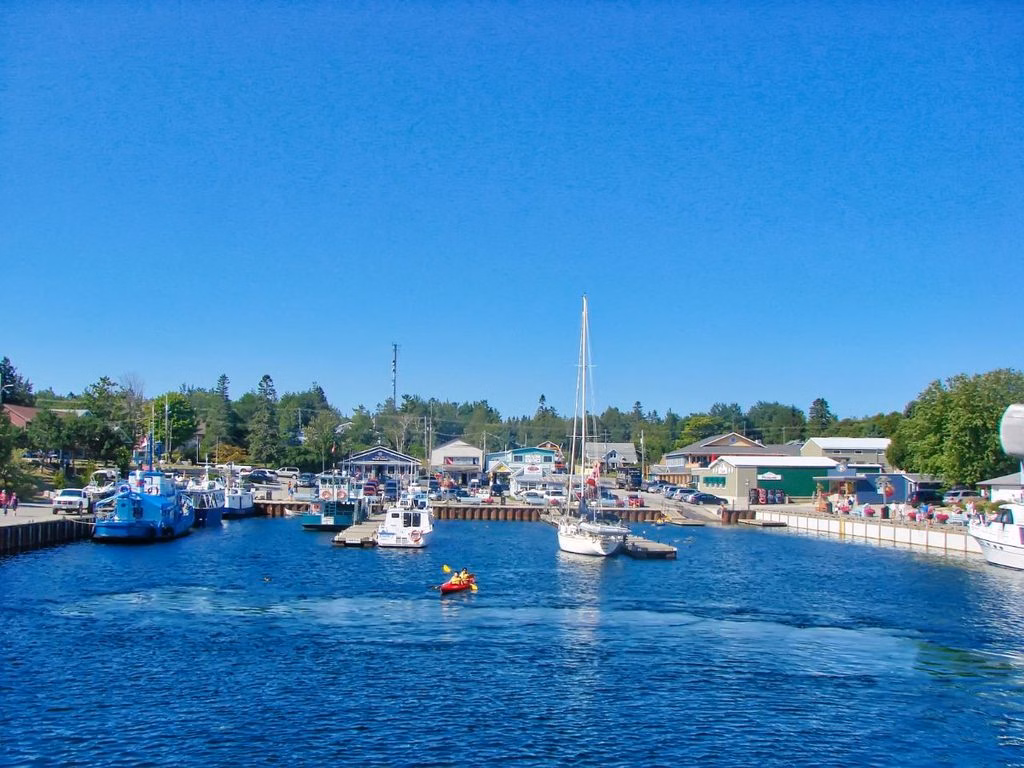 Kayaker leaving Tobermory Harbour, Ontario