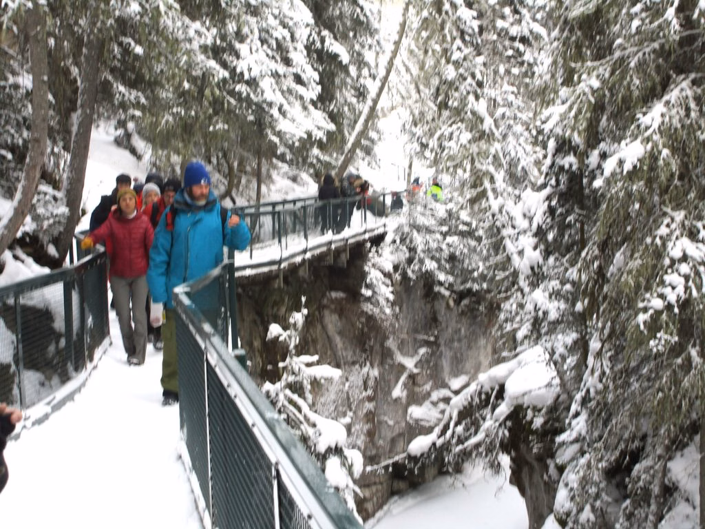 Group walking in Johnston Canyon in winter, Banff