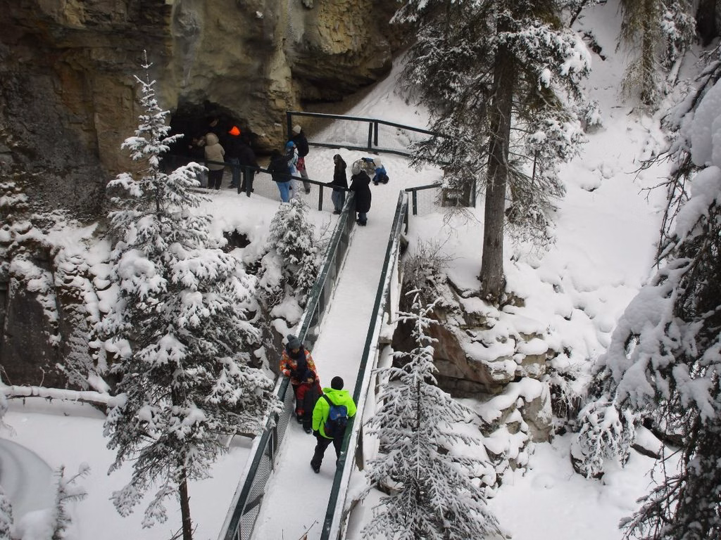 Group at Lower Falls in Johnston Canyon in winter, Banff