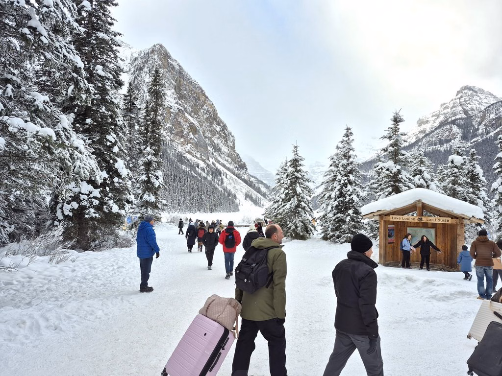People walking in Lake Louise in winter
